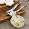 S62df941643d543a590b3e6f29ccb7789F.webp Knoblauchpresse aus Edelstahl zum Zerkleinern von Knoblauch