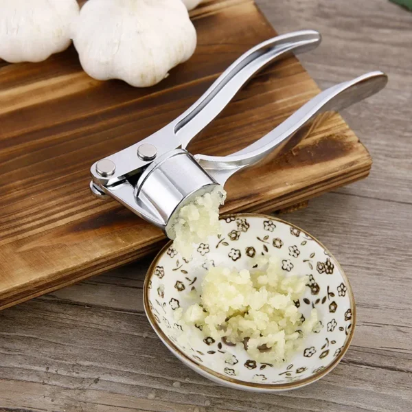 S62df941643d543a590b3e6f29ccb7789F.webp Knoblauchpresse aus Edelstahl zum Zerkleinern von Knoblauch